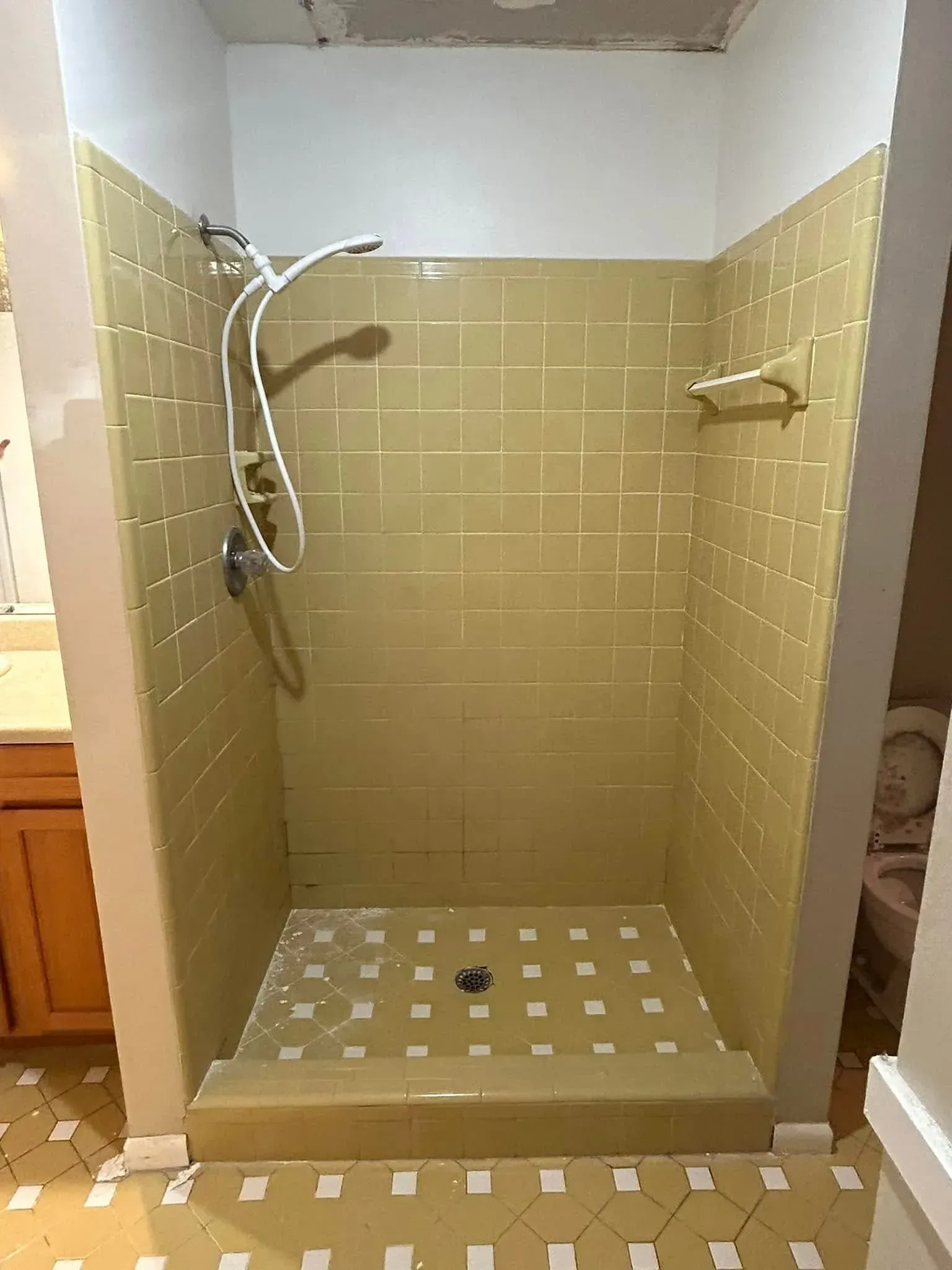 A bathroom with a walk in shower and a toilet.