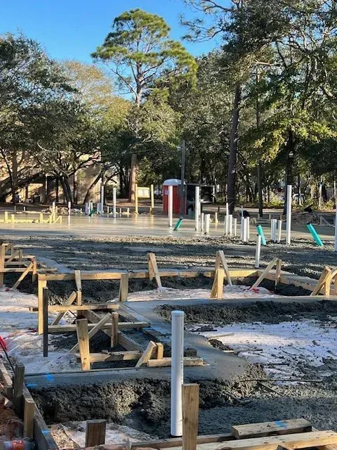 A construction site with trees in the background