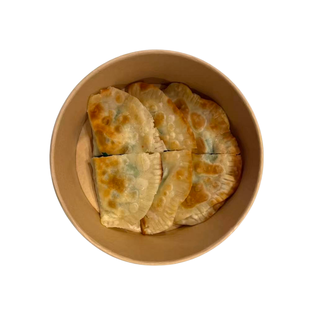 A round, light-brown paper bowl filled with five golden-brown, pan-fried dumplings arranged in two rows.