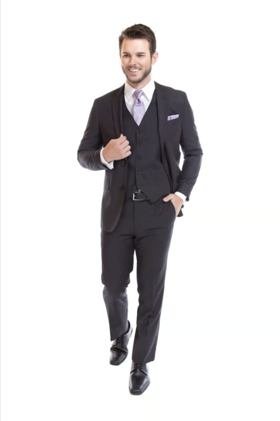 Man in a dark suit walking forward on a white background