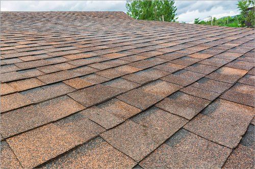 A close up of a roof with shingles on it.