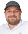A man wearing a hat with the word link on it