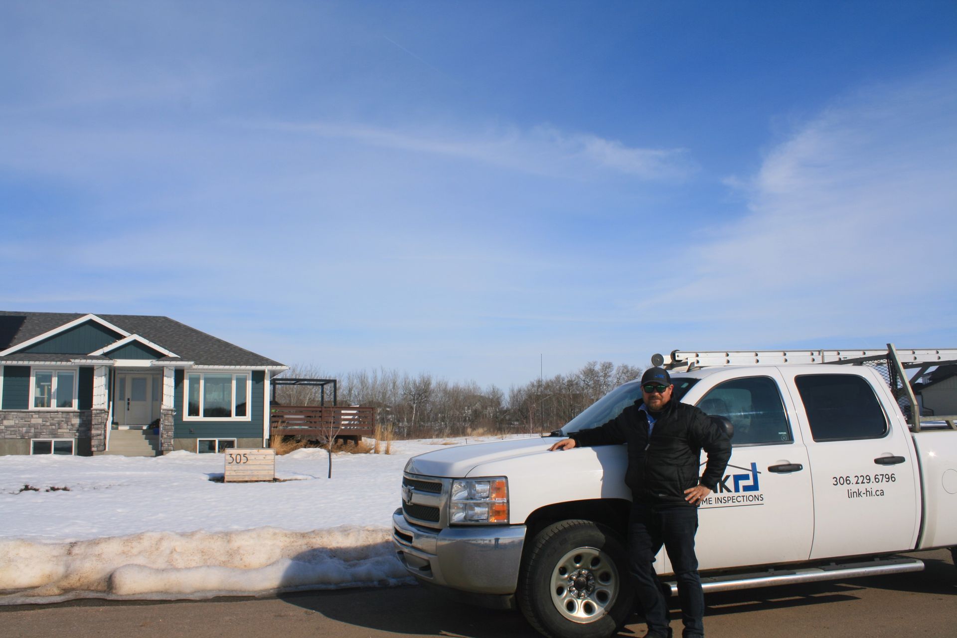 Certified home inspector performing an acreage inspection in rural Saskatchewan.