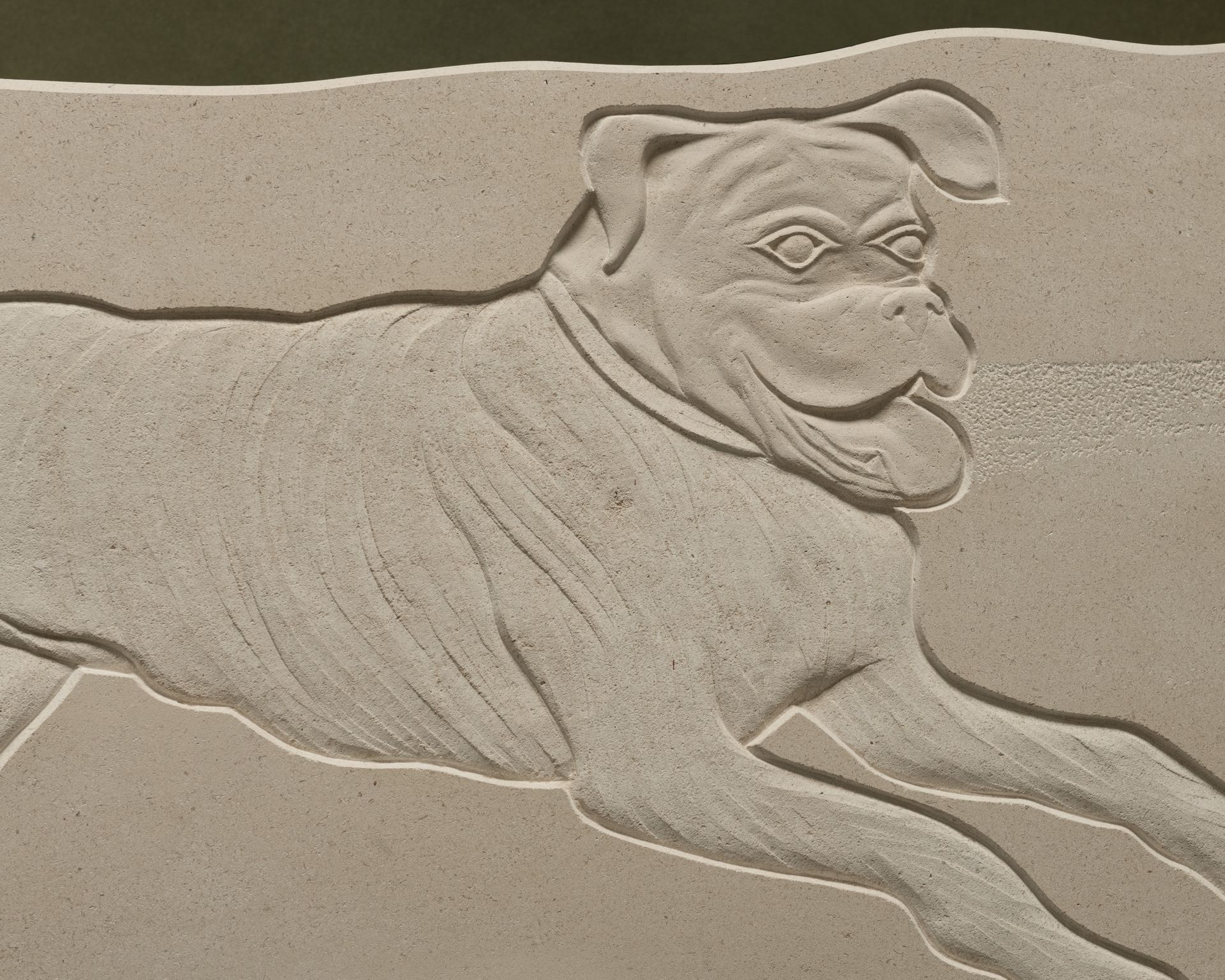 A plaque with a picture of a dog on it