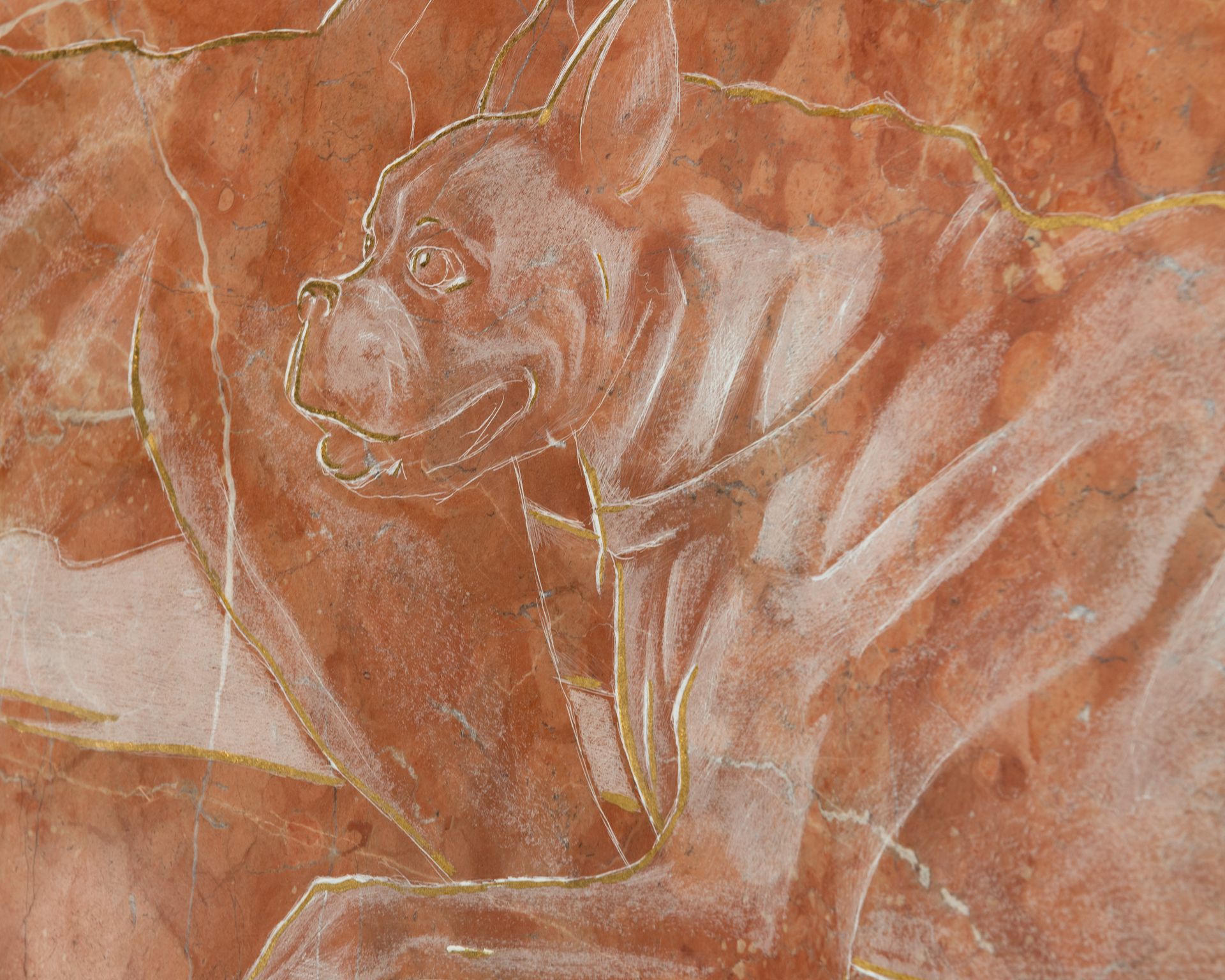 A piece of marble with a drawing of a dog on it