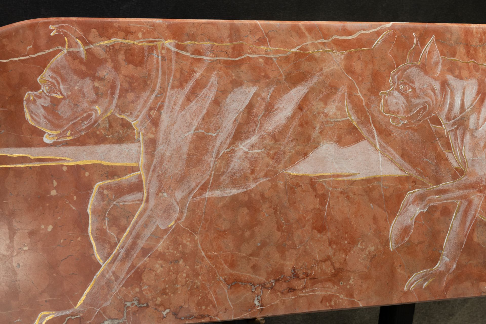 A piece of marble with a drawing of a dog on it