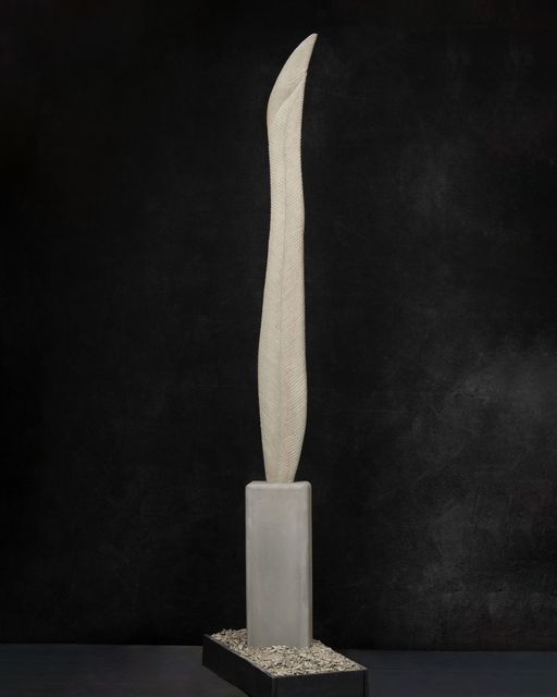 A tall white feather sculpture 