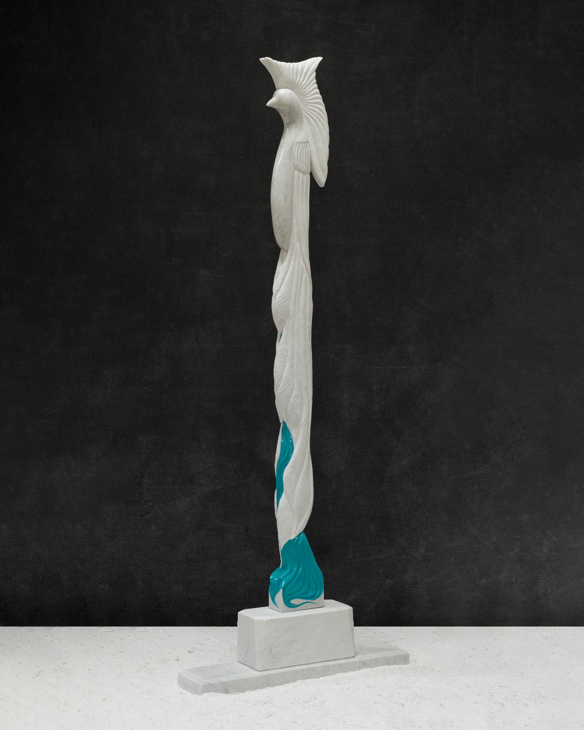 A white statue of a bird on a black background