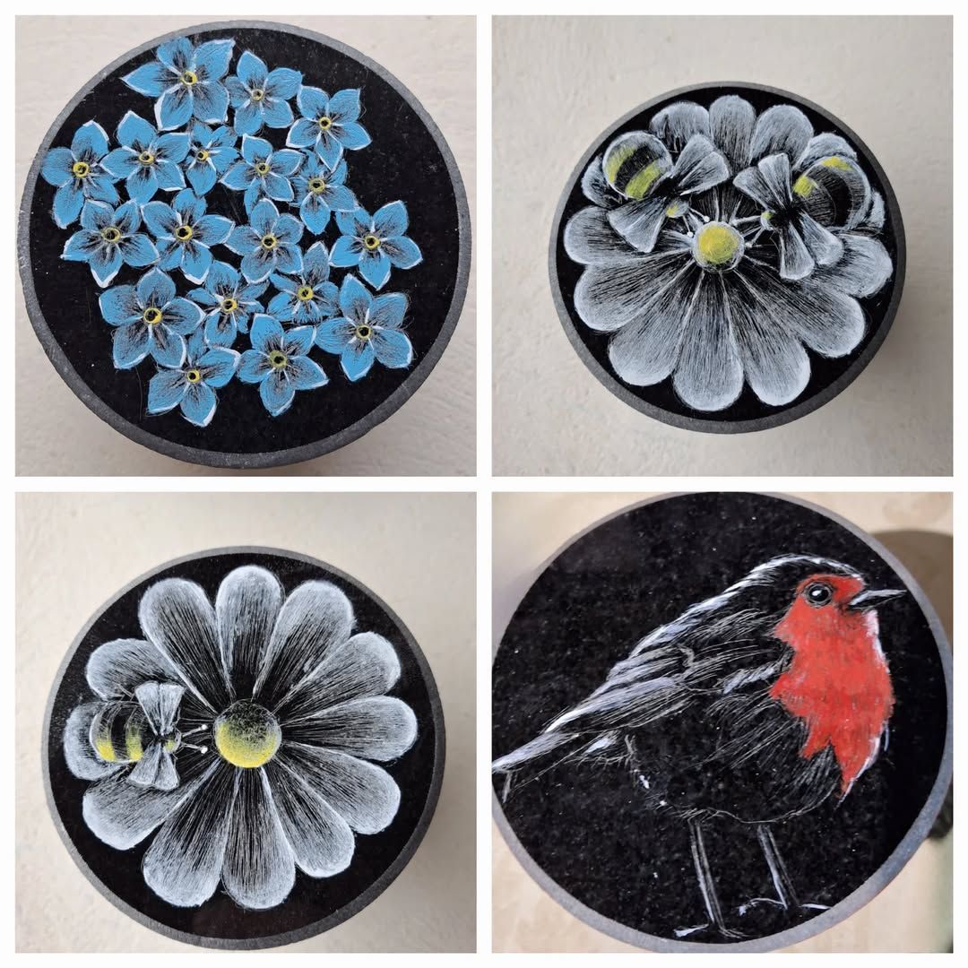 Four circular floral and bird chalk drawings, including blue flowers, white flowers, and a red-chested black bird.
