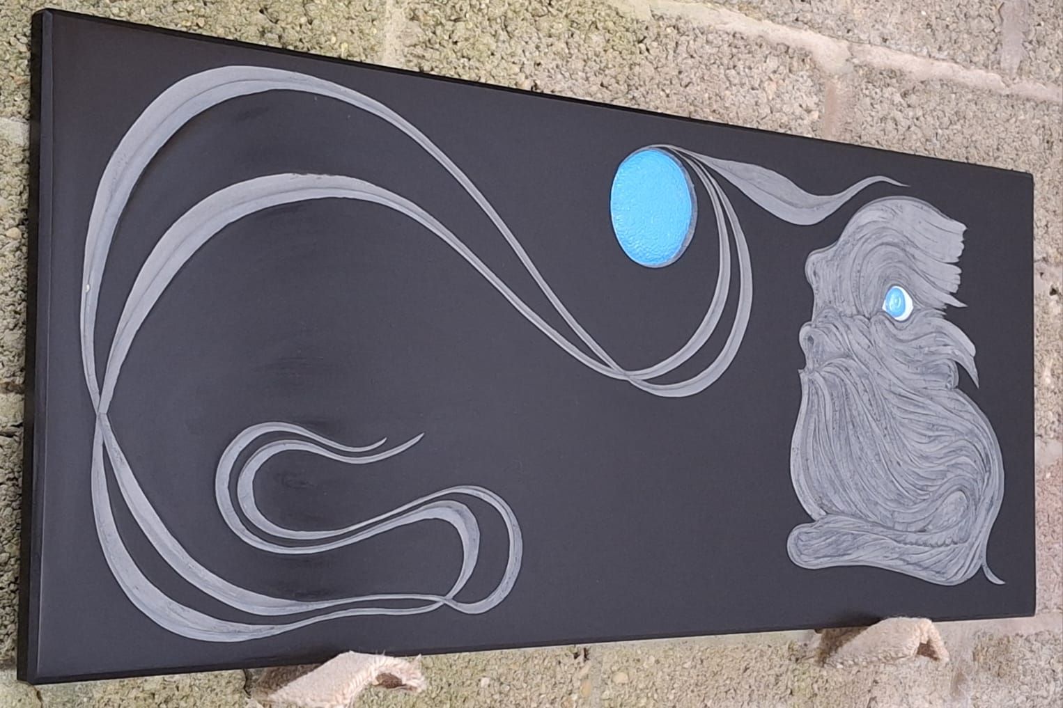 A painting of a rabbit with a blue moon in the background