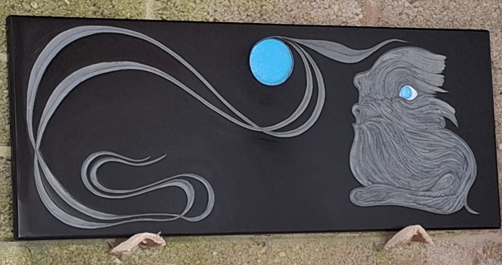 A painting of a rabbit with a blue moon in the background