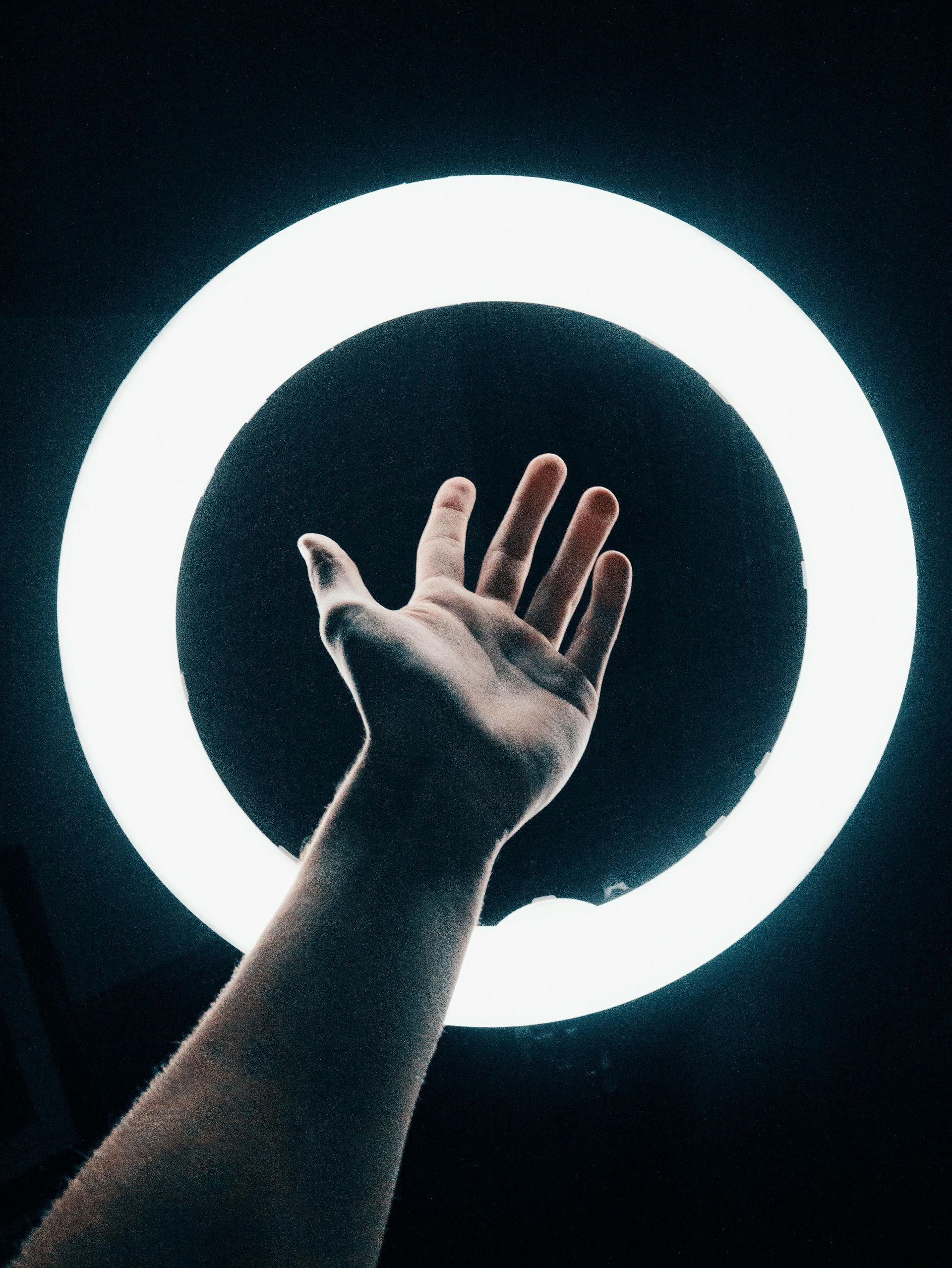hand in front of ring light