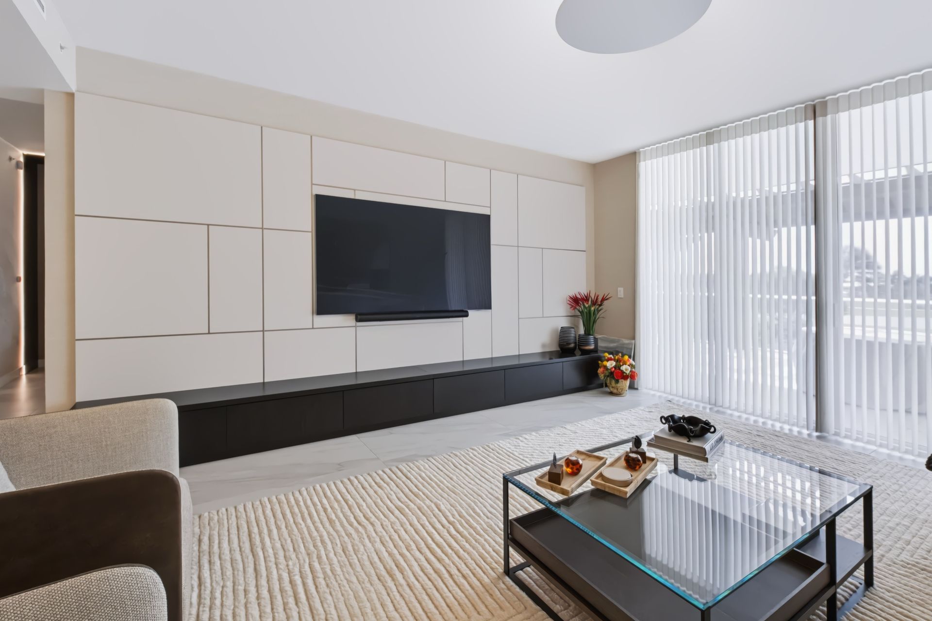 Living room with custom entertainment wall, Barbakoff Residence at Alina Residences, Boca Raton