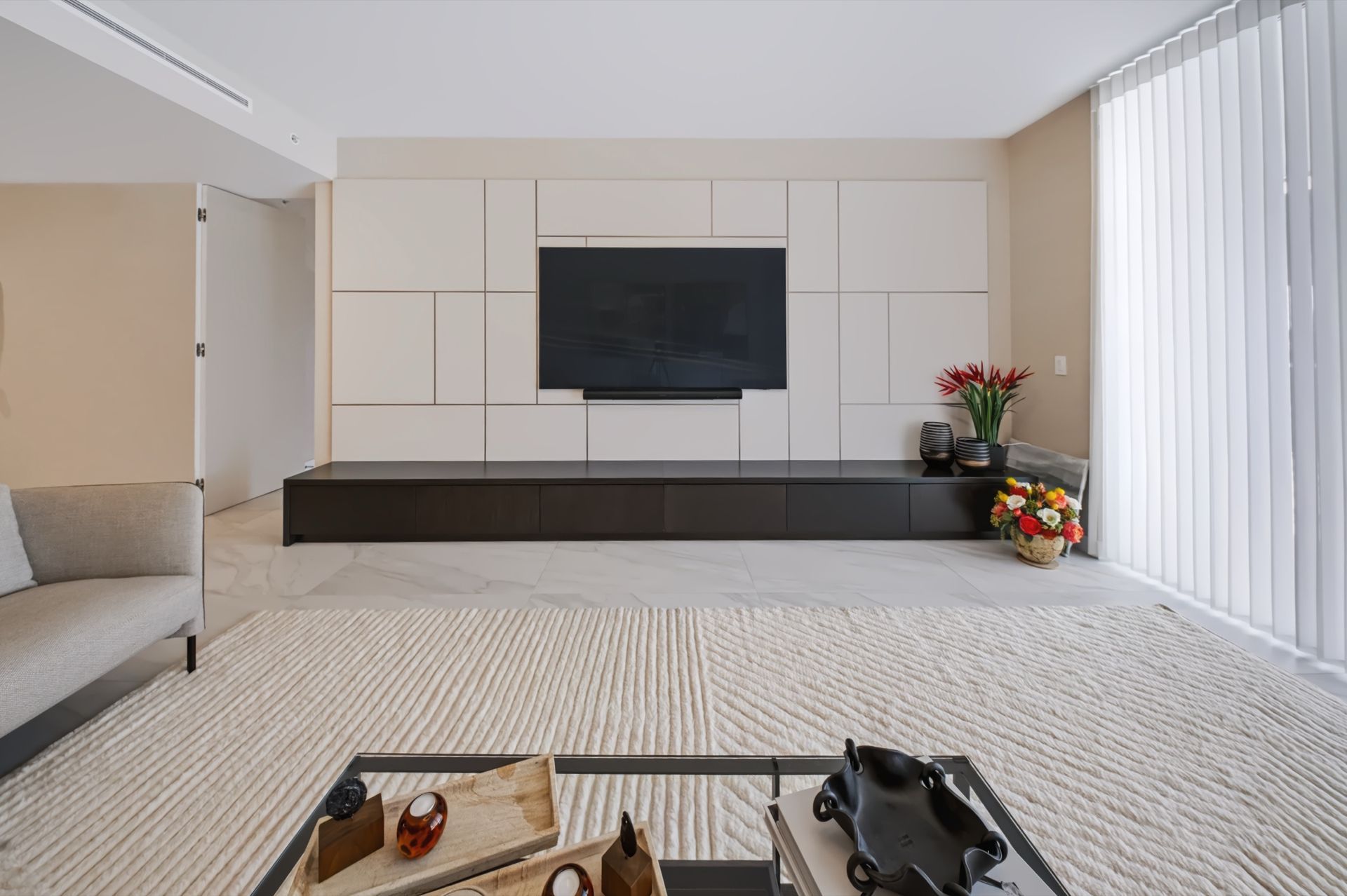 Living room with custom entertainment wall, Barbakoff Residence at Alina Residences, Boca Raton