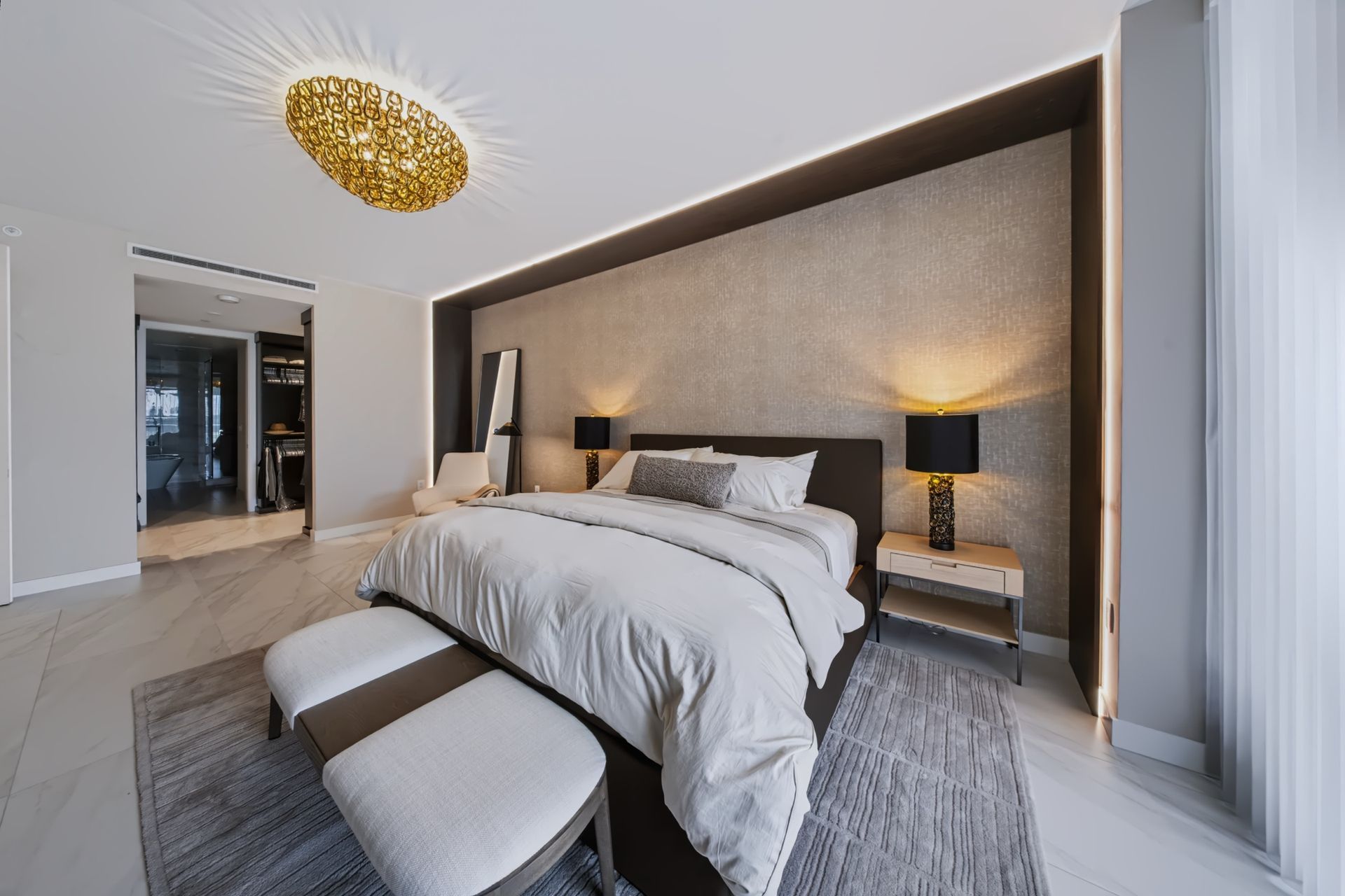 Primary bedroom with textured accent wall, Barbakoff Residence at Alina Residences, Boca Raton