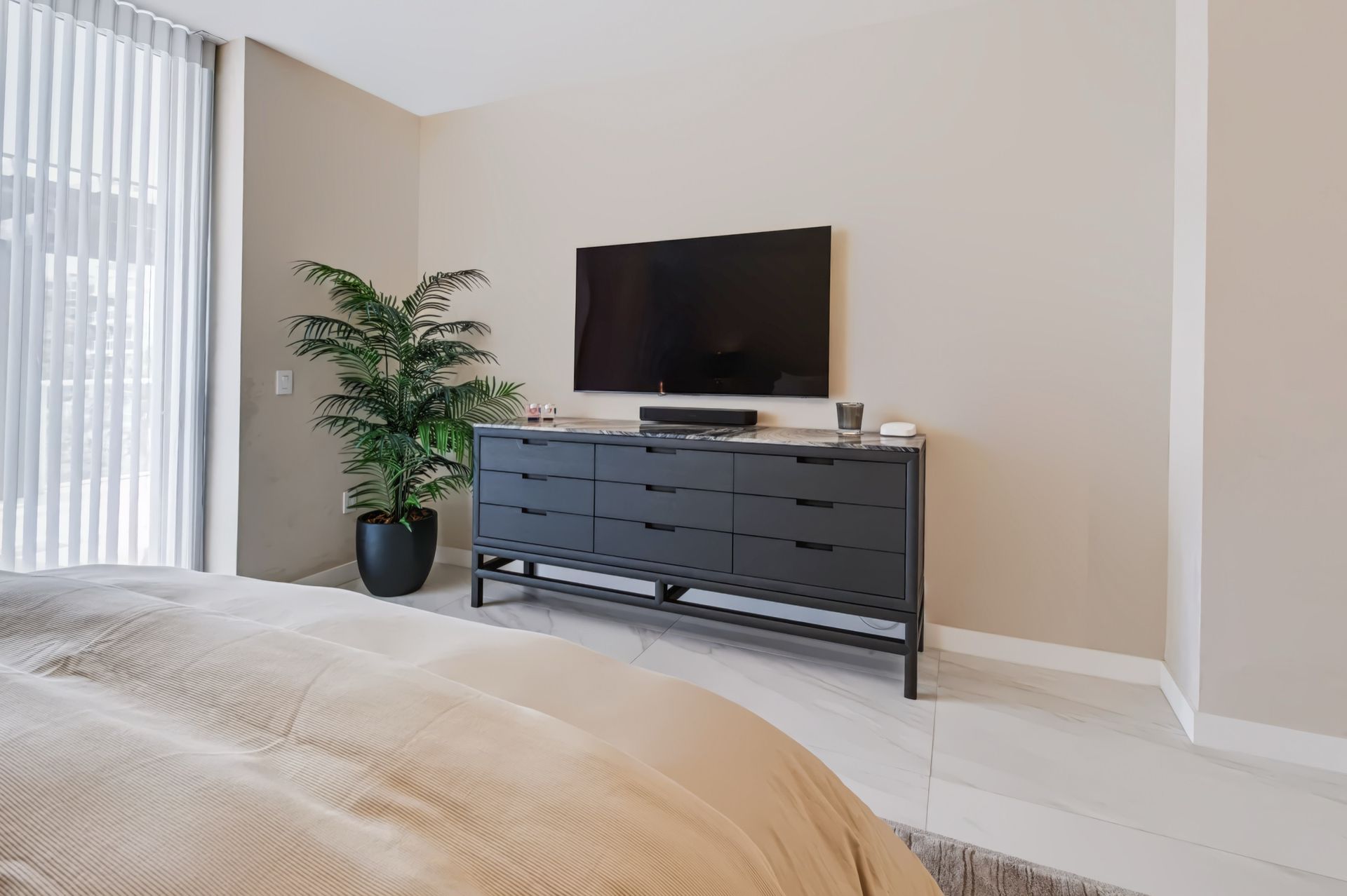 Primary bedroom with textured accent wall, Barbakoff Residence at Alina Residences, Boca Raton