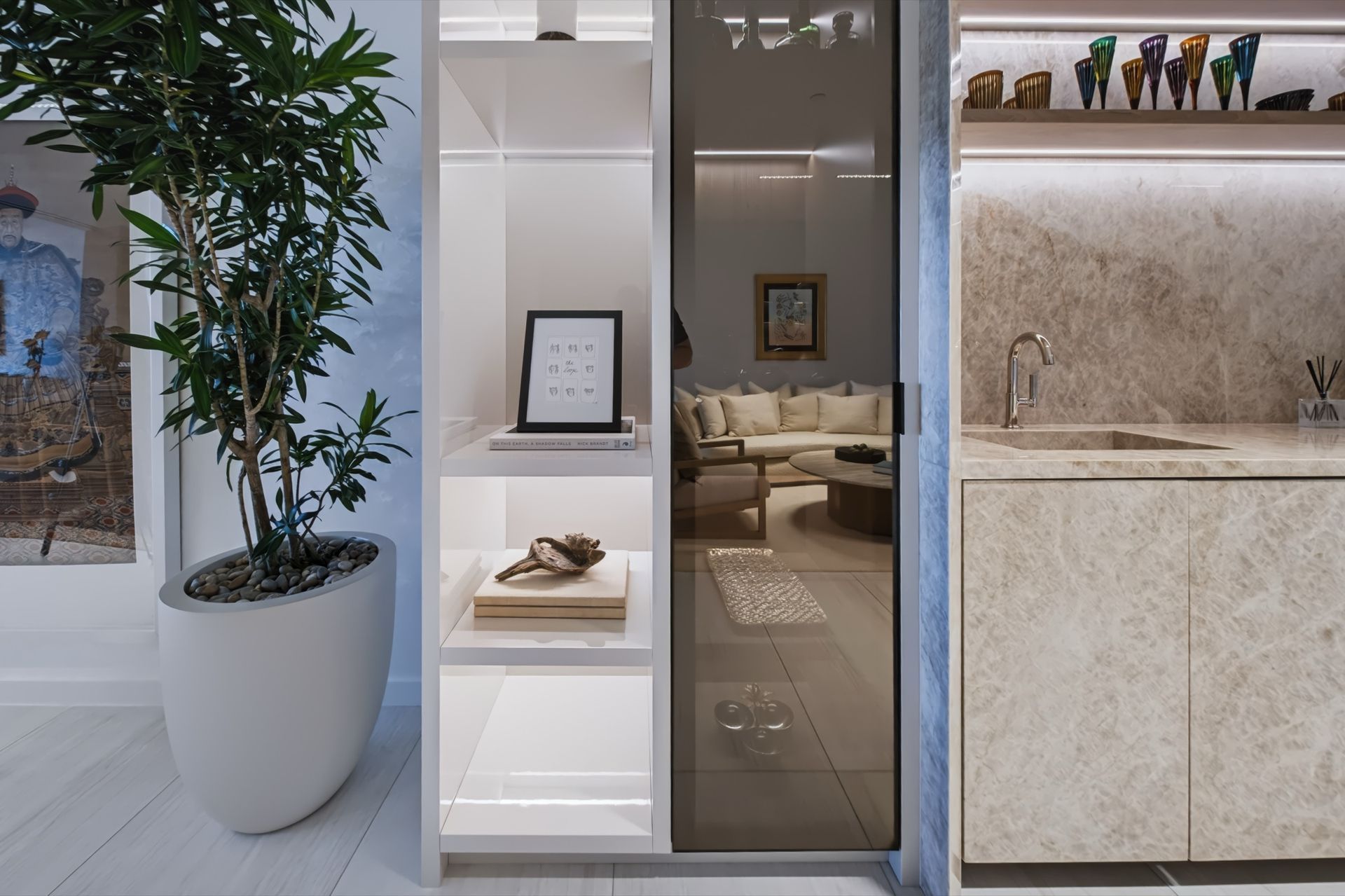 Lounge and bar with Taj Mahal stone and illuminated cabinetry, Finn Residence at Alina Residences, Boca Raton