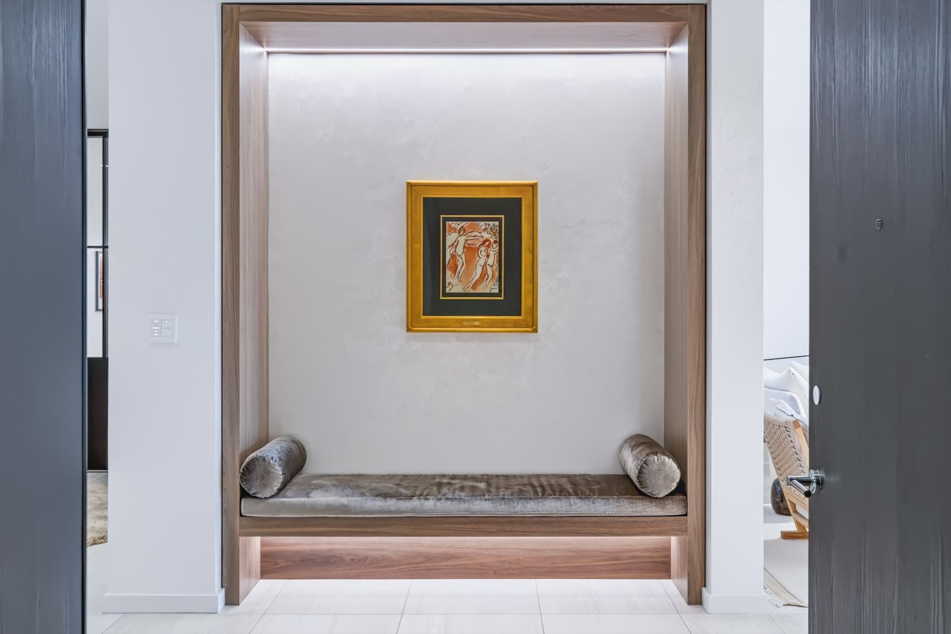 Entry with lit oak niche and bench, Finn Residence at Alina Residences, Boca Raton