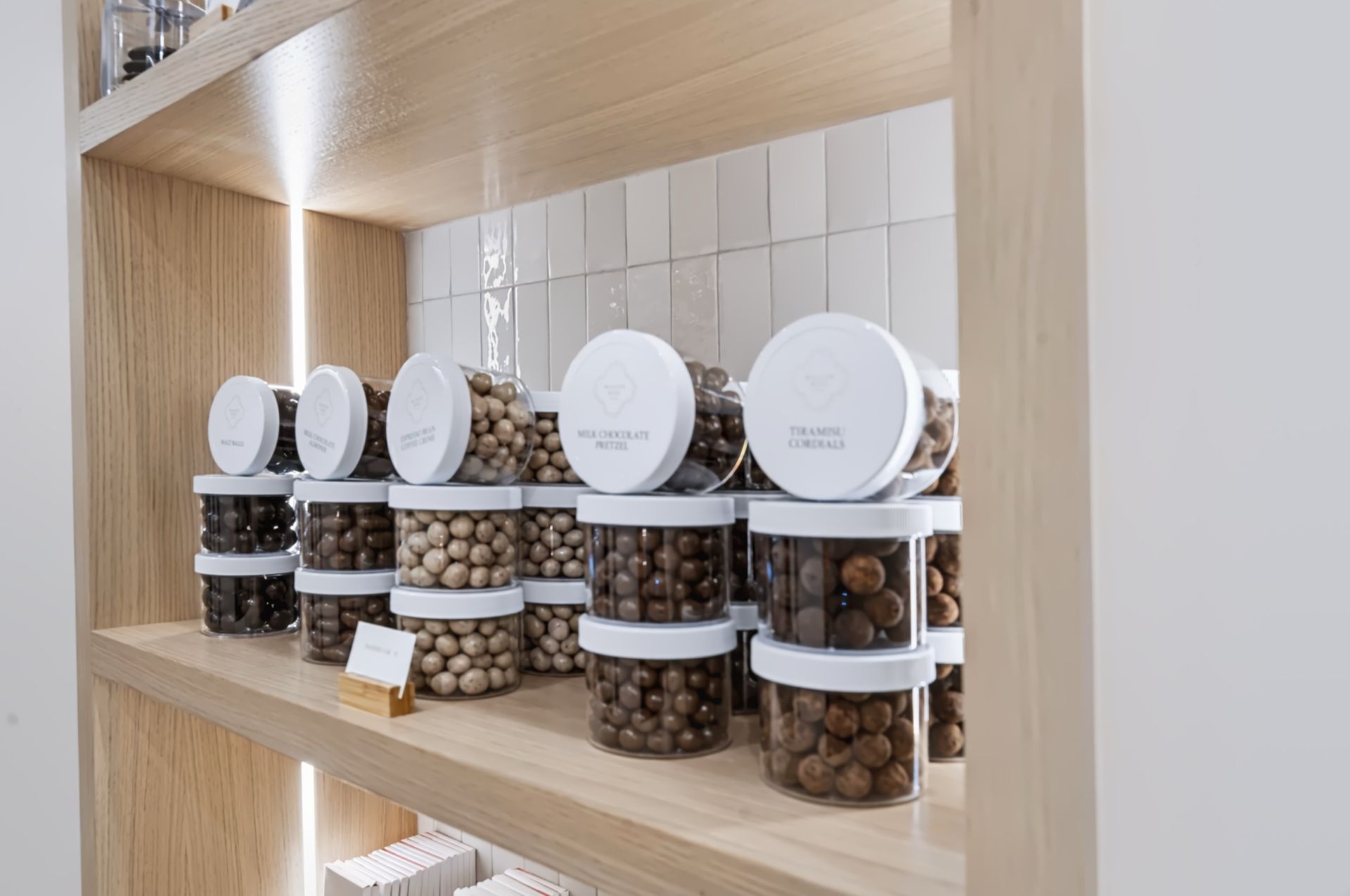 Arched boutique shelving with integrated lighting, Maison Rose at The Boca Raton