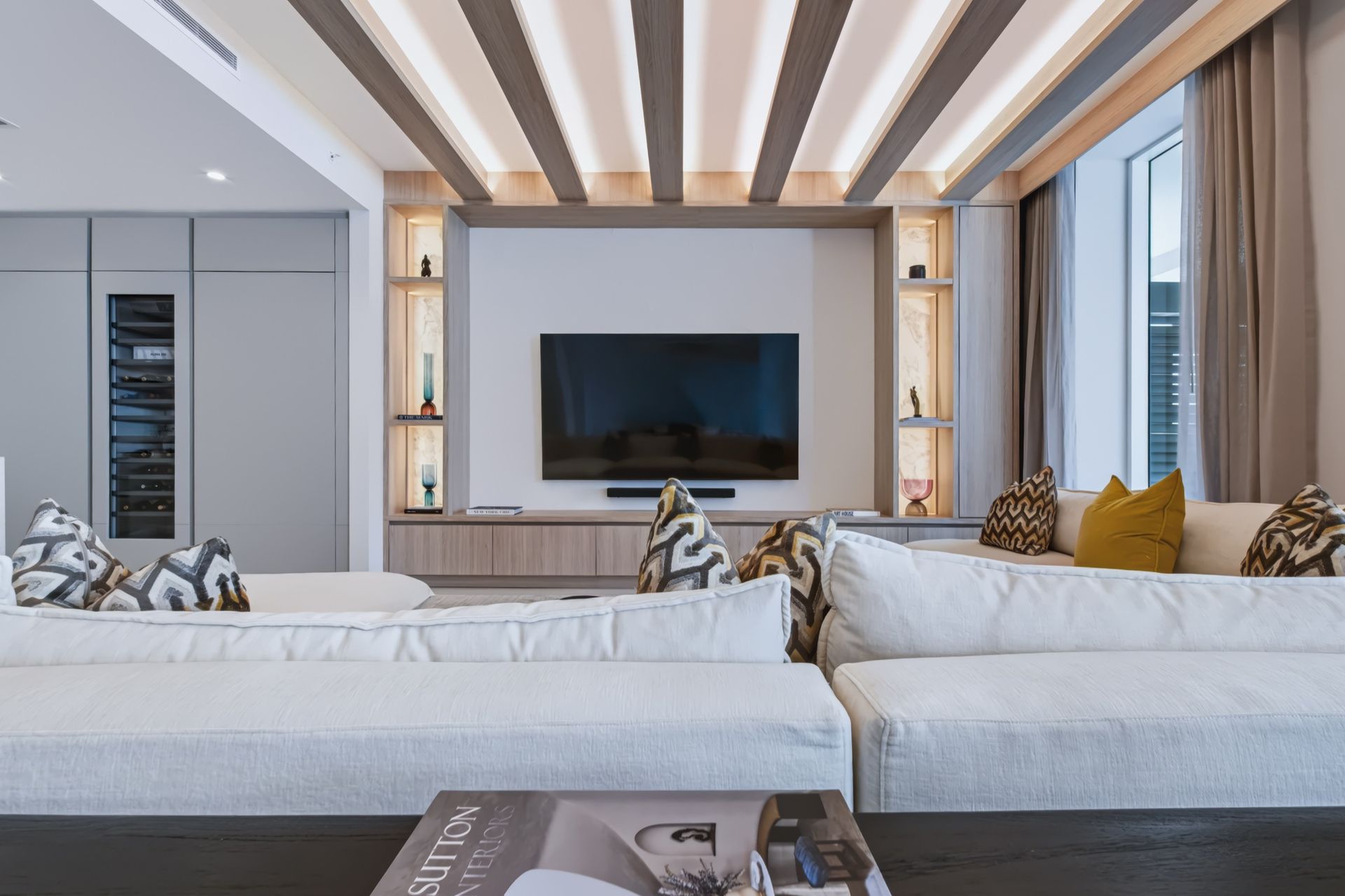Living room with oak ceiling beams and integrated LED lighting, Streinger Residence at Alina Residences, Boca Raton