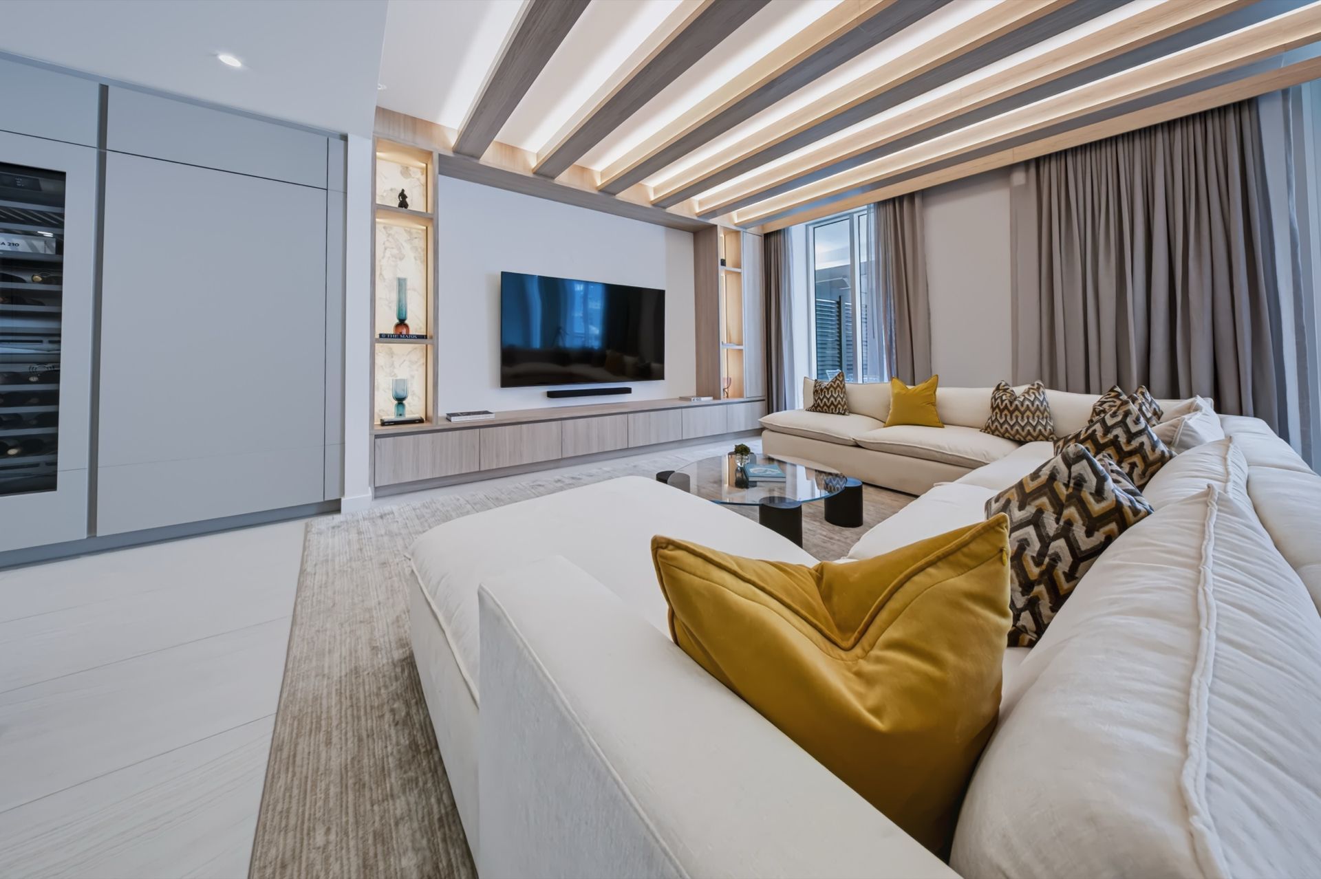 Living room with oak ceiling beams and integrated LED lighting, Streinger Residence at Alina Residences, Boca Raton