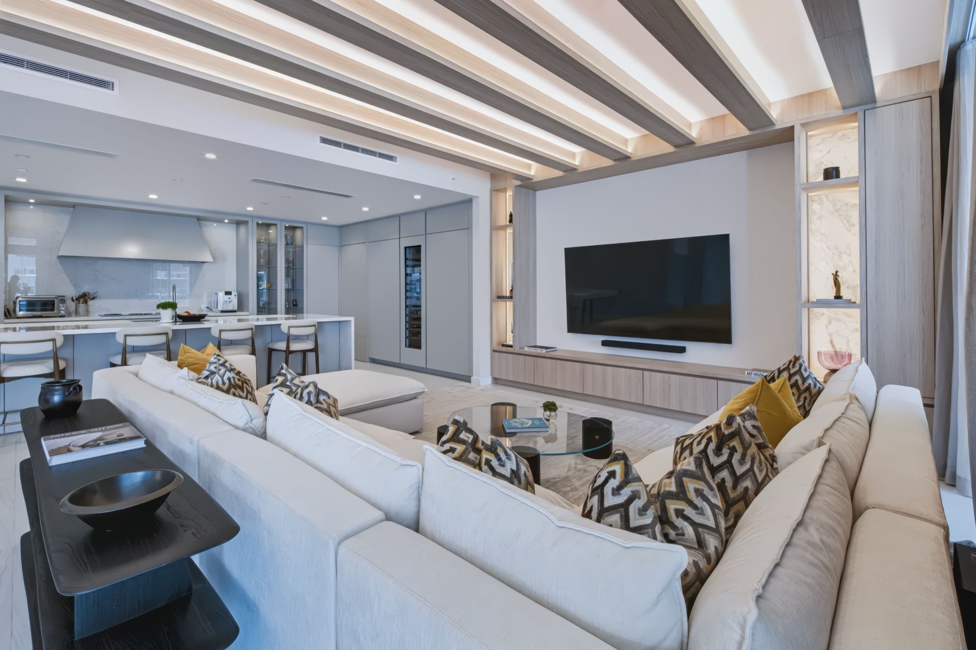 Living room with oak ceiling beams and integrated LED lighting, Streinger Residence at Alina Residences, Boca Raton