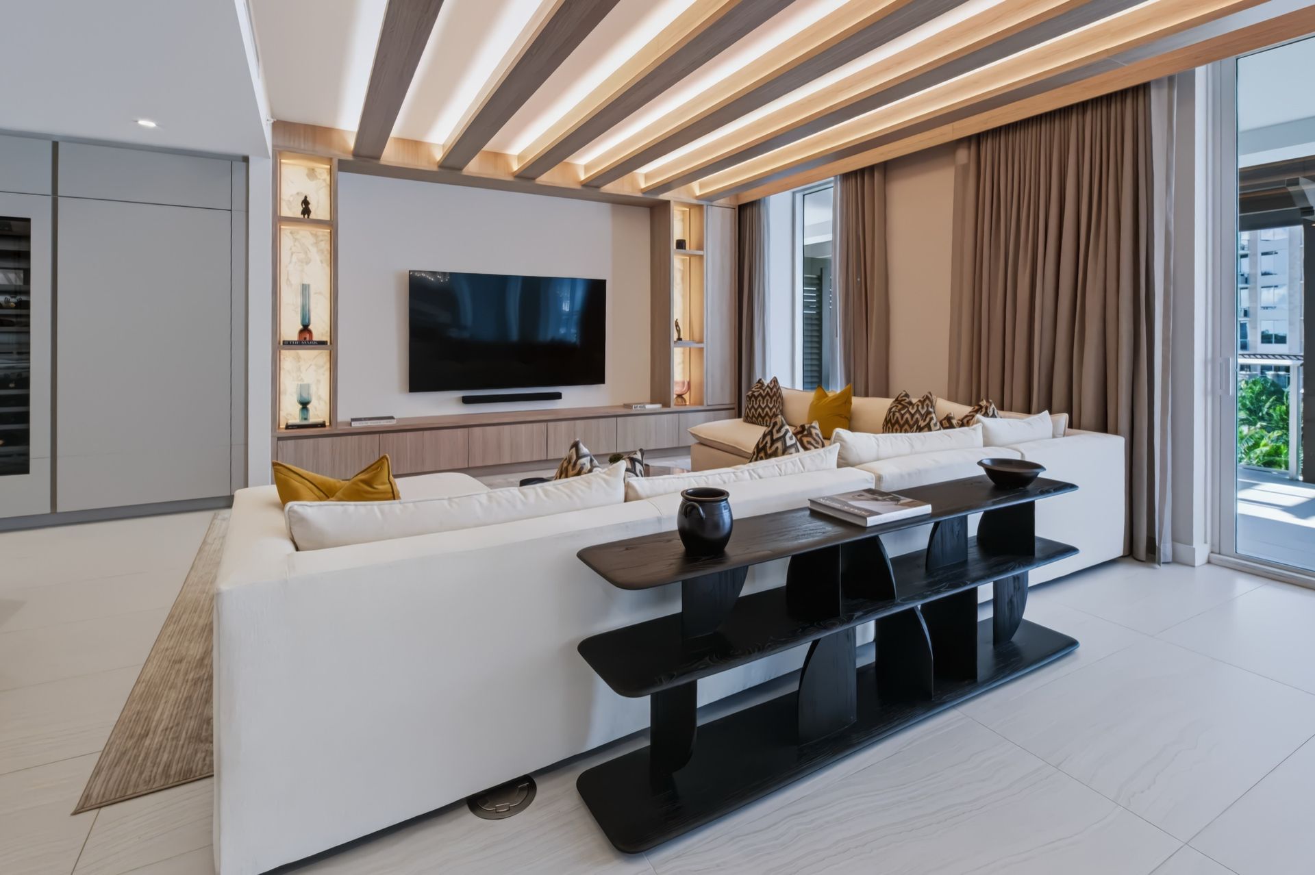 Living room with oak ceiling beams and integrated LED lighting, Streinger Residence at Alina Residences, Boca Raton