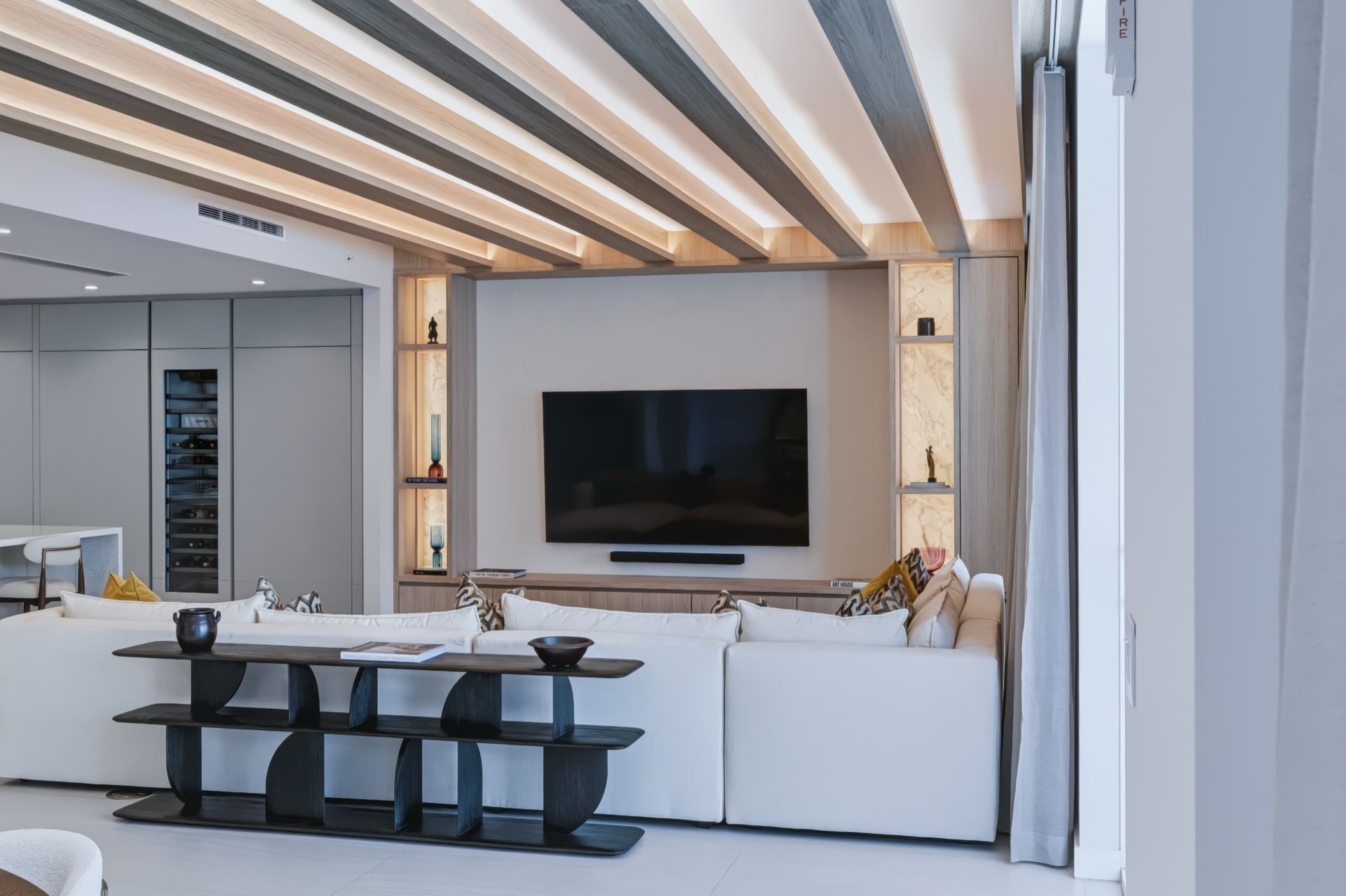 Living room with oak ceiling beams and integrated LED lighting, Streinger Residence at Alina Residences, Boca Raton