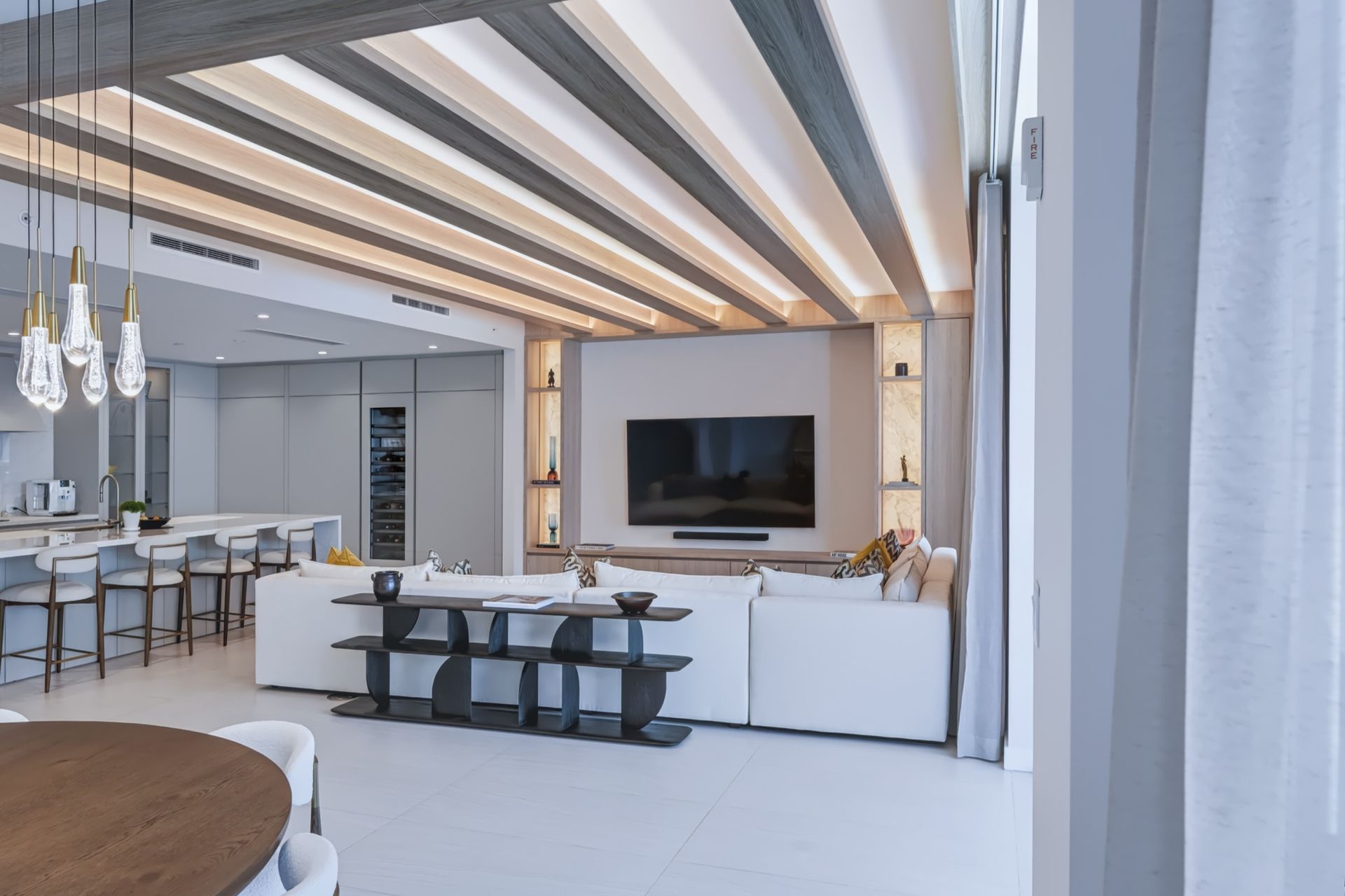 Living room with oak ceiling beams and integrated LED lighting, Streinger Residence at Alina Residences, Boca Raton