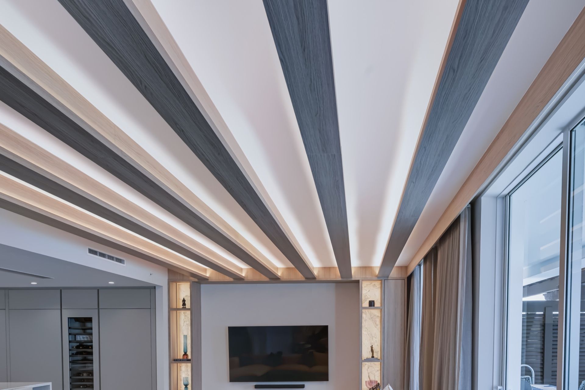 Living room with oak ceiling beams and integrated LED lighting, Streinger Residence at Alina Residences, Boca Raton