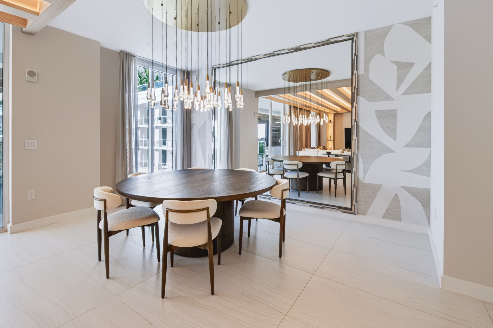 Dining room with oversized custom mirror and crystal chandelier, Streinger Residence at Alina Residences, Boca Raton