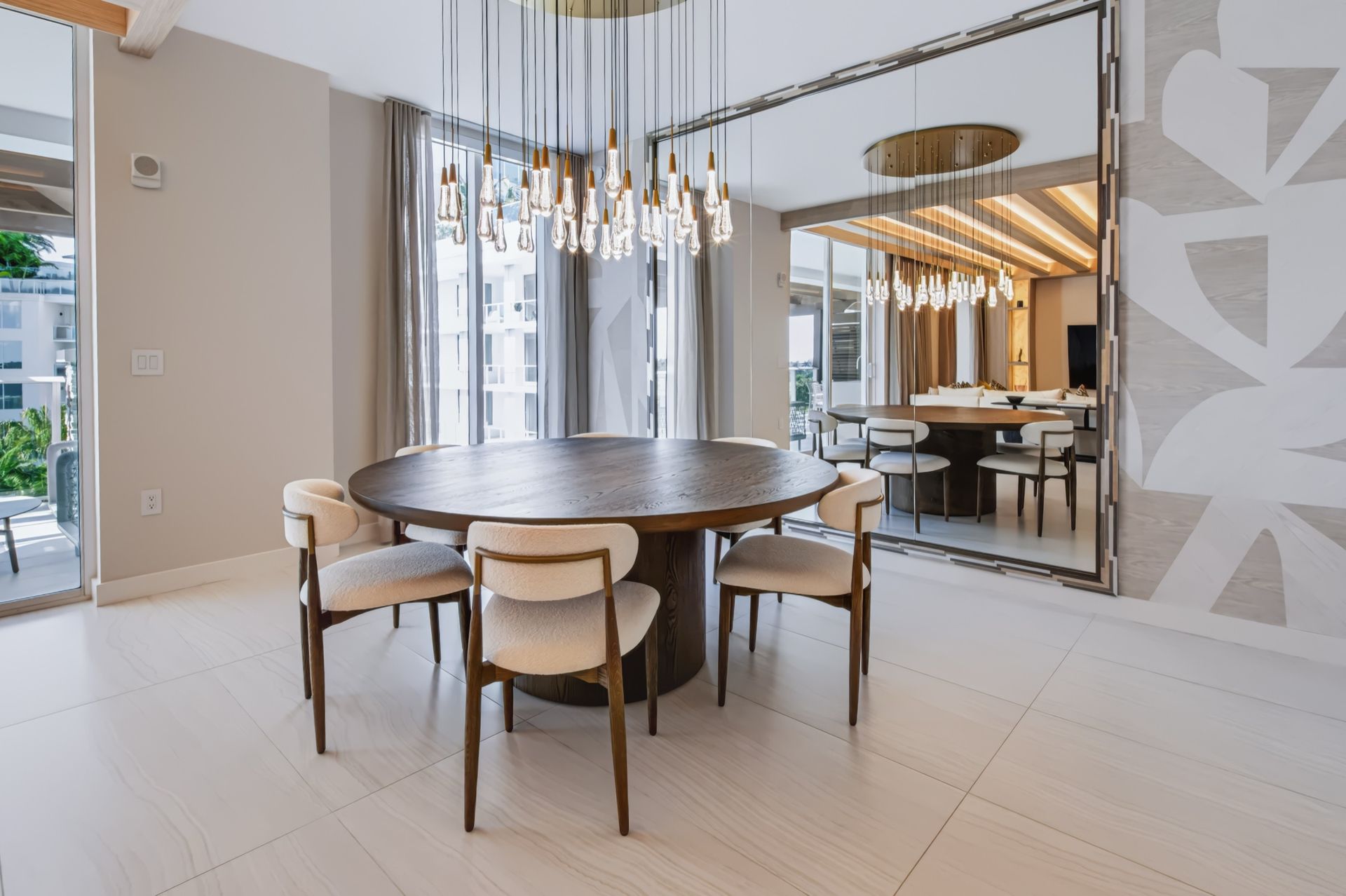Dining room with oversized custom mirror and crystal chandelier, Streinger Residence at Alina Residences, Boca Raton