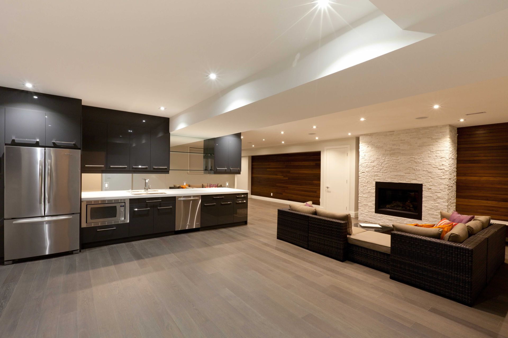 a living room with a couch and a refrigerator