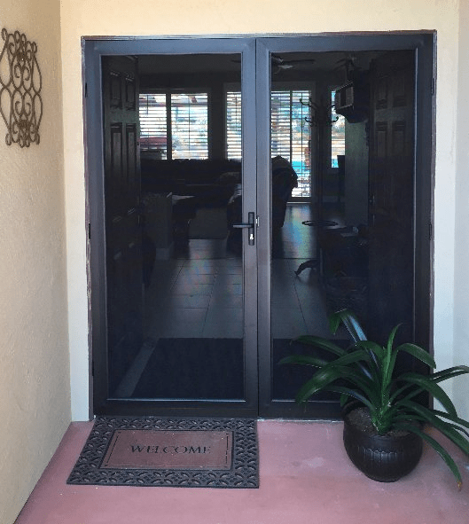 A door with a welcome mat in front of it
