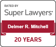 The logo for super lawyers is rated by delmer r. mitchell for 20 years.