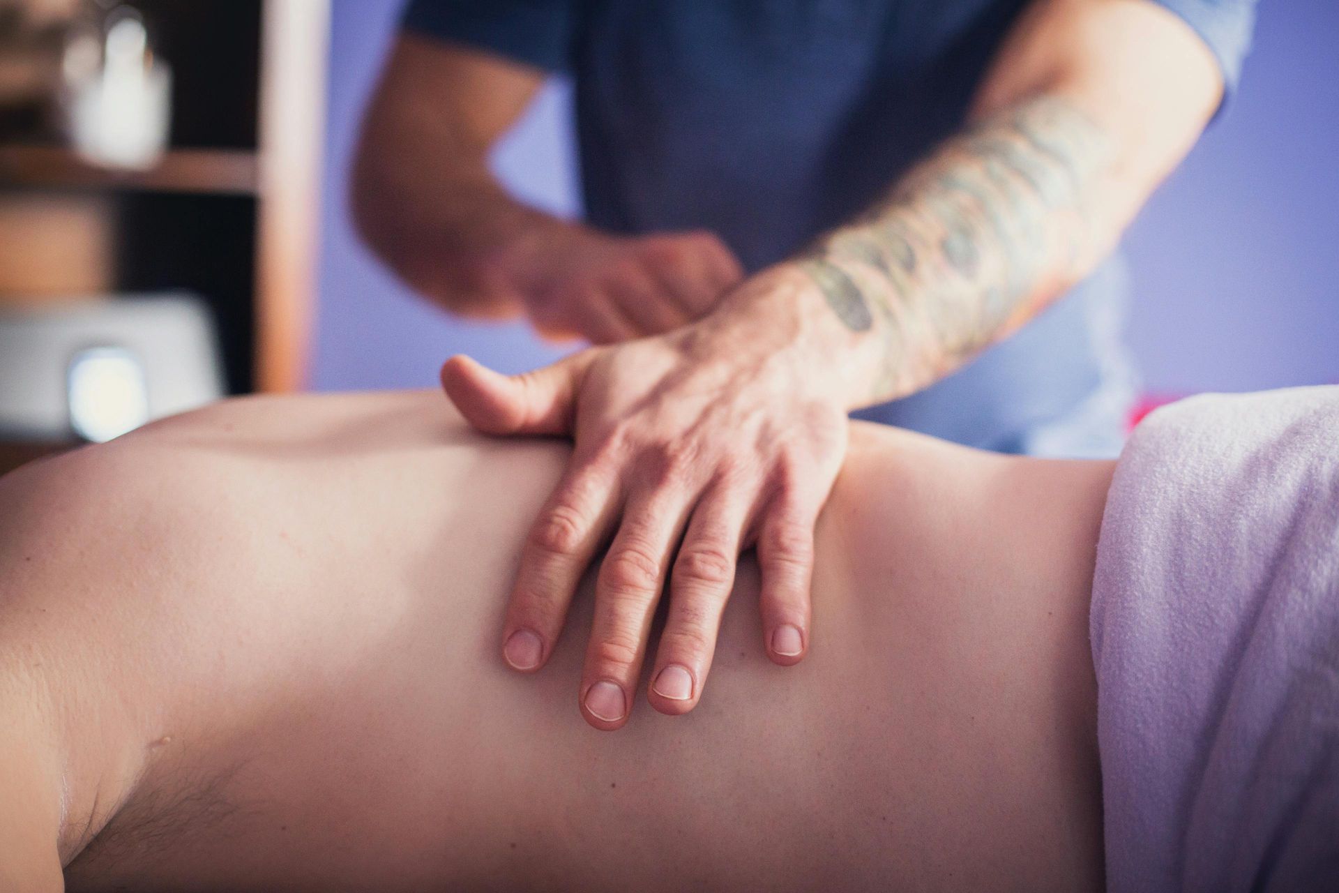 Person Receiving a Back Massage With Tattooed Arm — Leela Thai Massage & Spa in Newtown, QLD