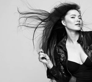 A black and white photo of a woman with long hair