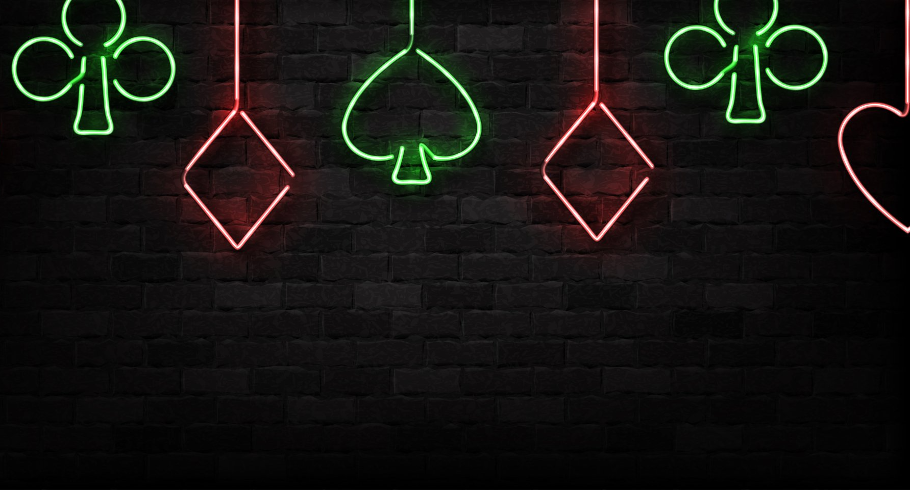 Various neon signs showing clubs, diamonds, spades, and a heart.