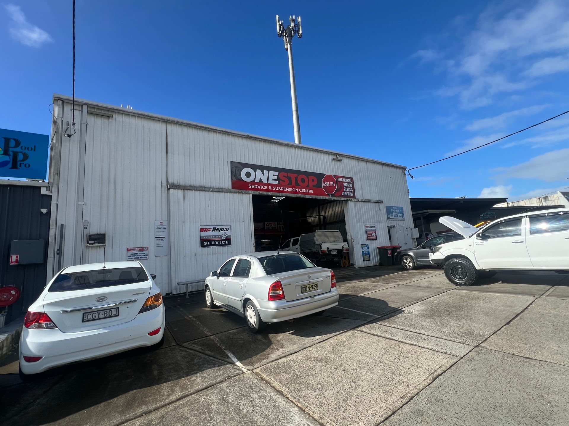A LPG Gas Station With Cars Parked in Front of It — One Stop Service and Suspension Centre In Port Macquarie, NSW