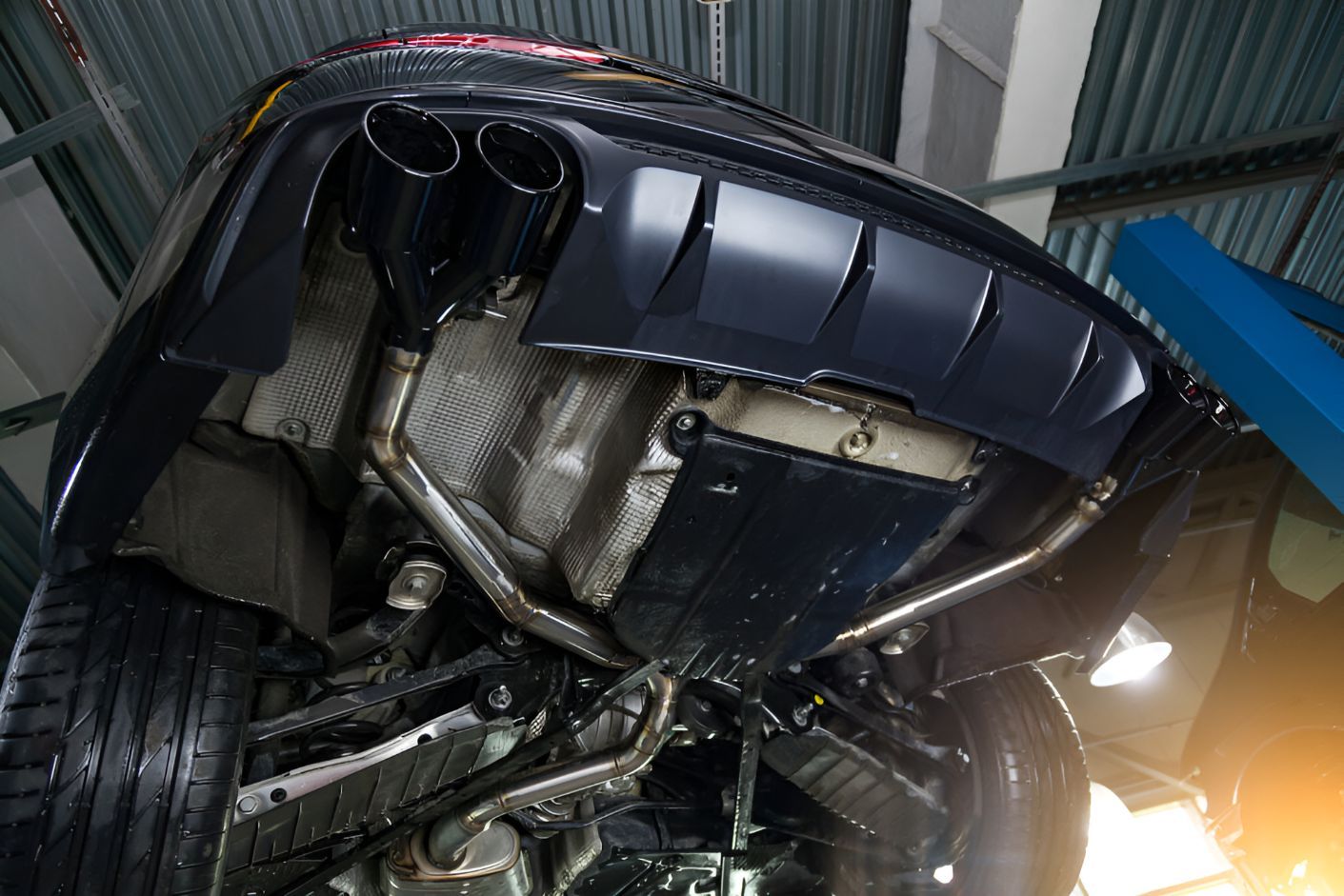 The Underside of a Car is Shown in a Garage — One Stop Service and Suspension Centre In Port Macquarie, NSW