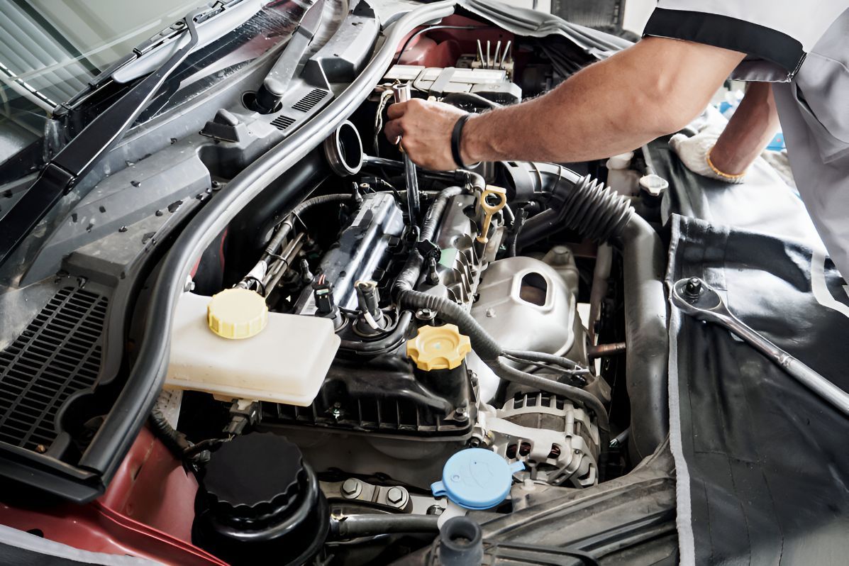 Man is Working on the Engine of a Car — One Stop Service and Suspension Centre In Port Macquarie, NSW