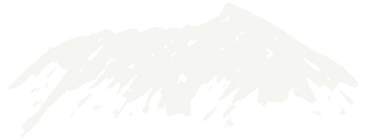 Pale snowy mountain peak rising above a white sky