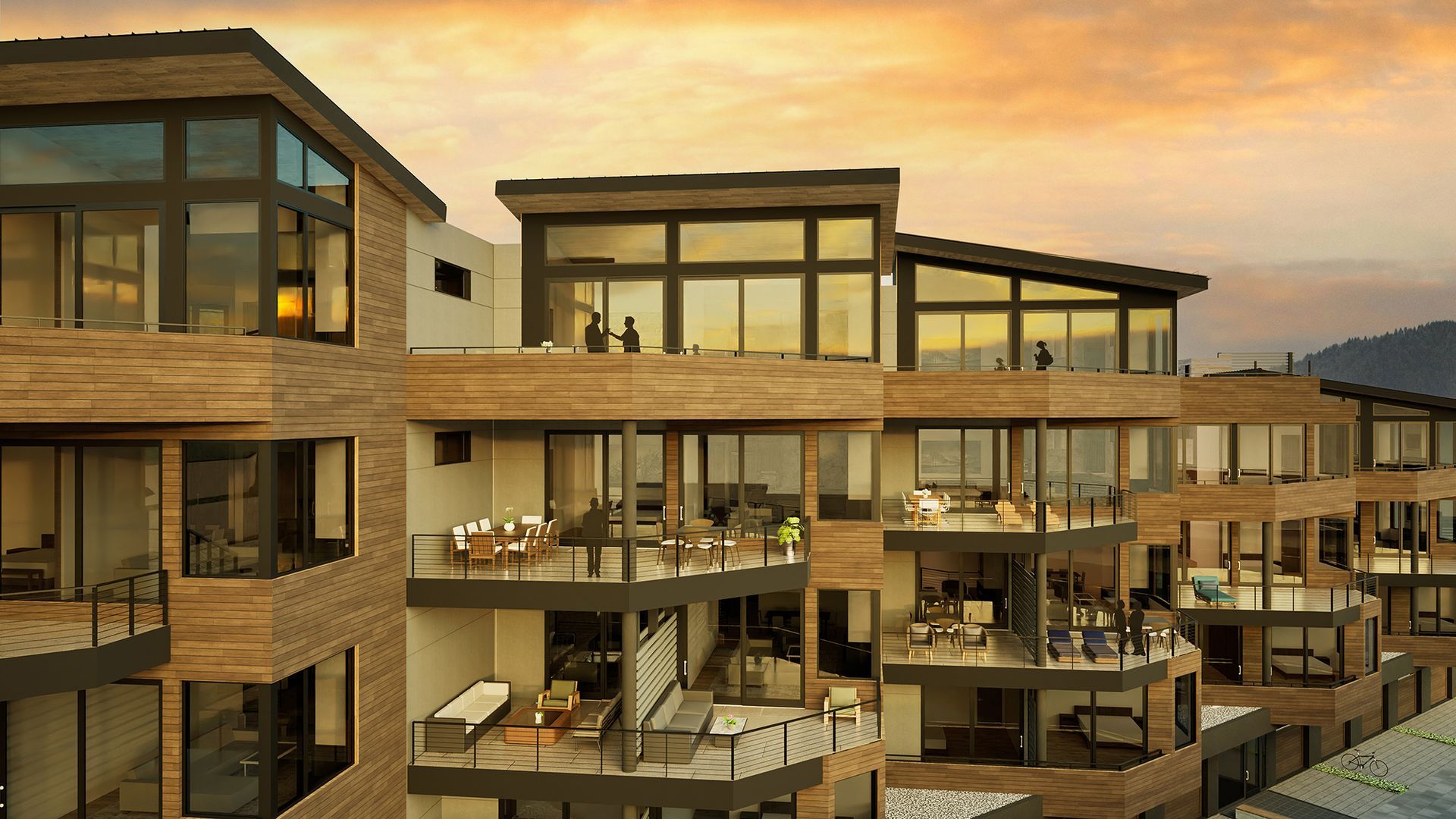 Modern apartment complex with wood balconies at sunset, overlooking the sea