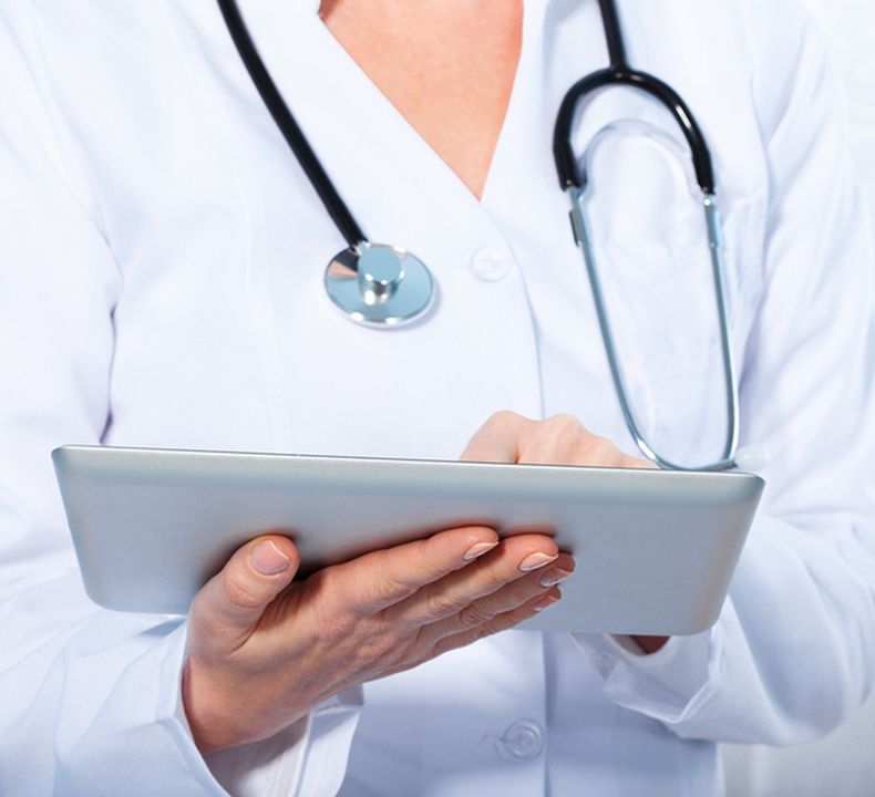 Doctor With Tablet and Stethoscope on her Shoulder