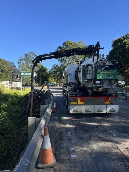 Truck With a Long Arm Over a Bridge, Likely for Maintenance Work; Daytime — Tyzac Group in Beerwah, QLD