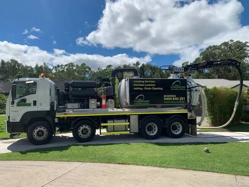 A Large White Vacuum Truck Parked on a Residential Street — Tyzac Group in Beerwah, QLD
