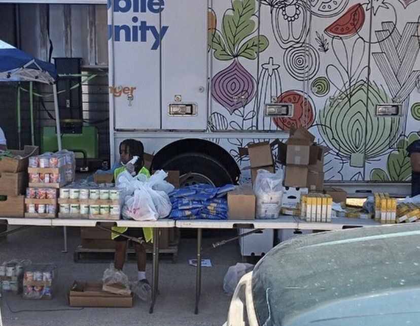 A mobile unity truck is parked in a parking lot