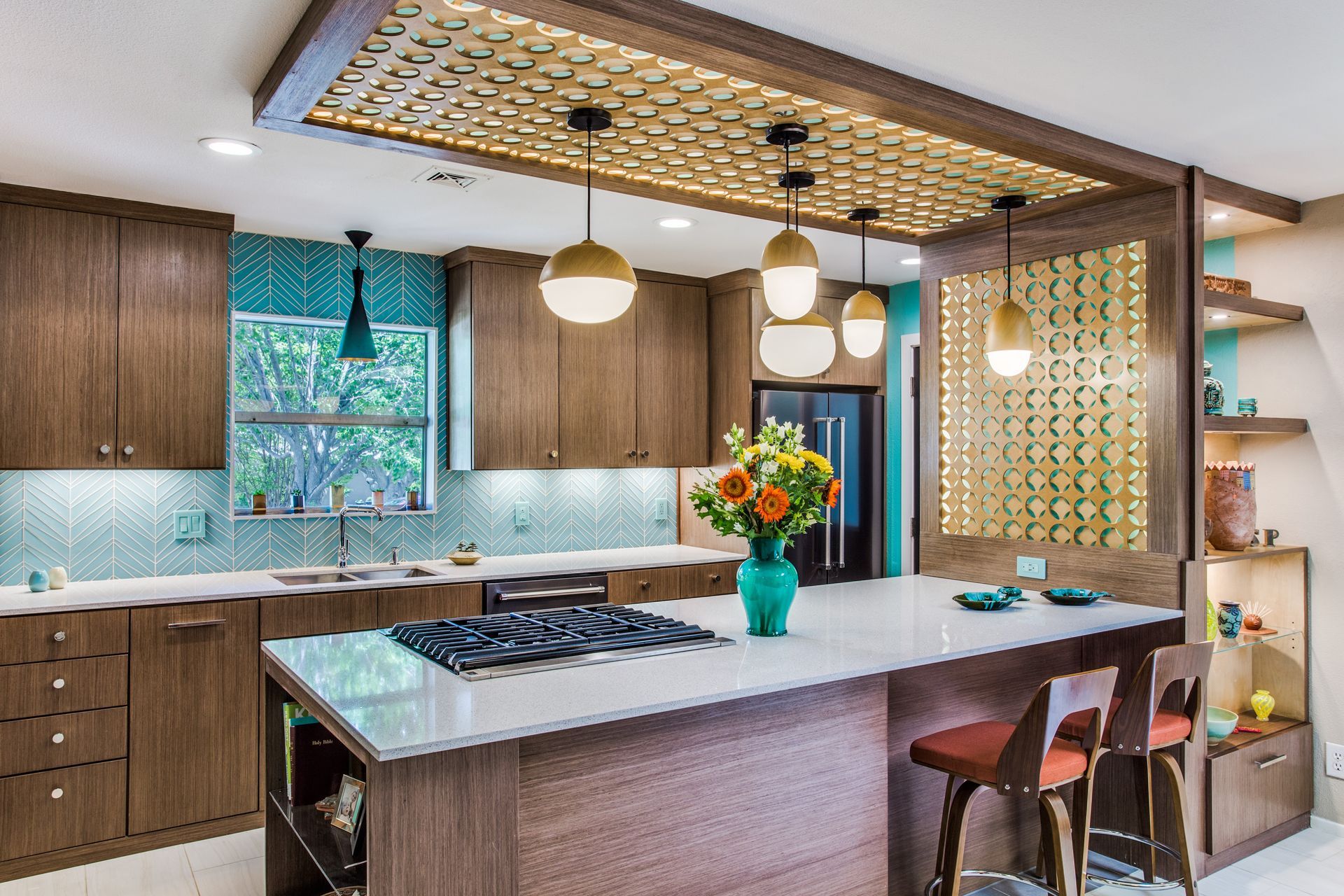 A Dallas remodel kitchen with a large island and a stove top oven.
