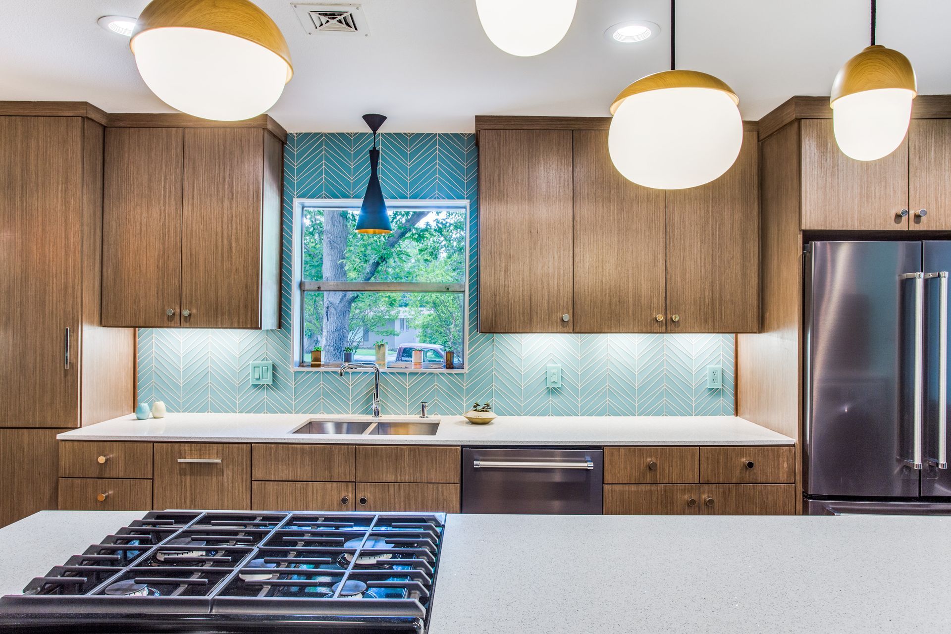 A kitchen with stainless steel appliances and wooden cabinets