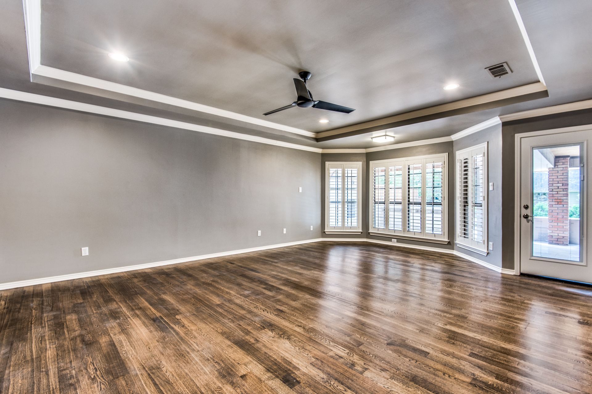 Plano home remodel  hardwood floors and a ceiling fan.
